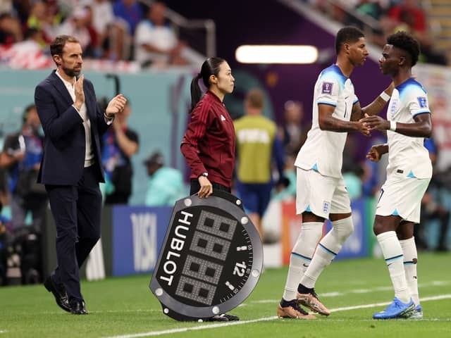 Marcus Rashford and Bukayo Saka of England are substituted during the FIFA World Cup Qatar 2022 Group B match between England and USA at Al Bayt Stadium on November 25, 2022 in Al Khor, Qatar. (Photo by Elsa/Getty Images)