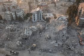 An aerial view of work machines and diggers at the site of collapsed buildings on February 16, 2023 in Hatay, Turkey