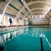 Stephanie Jones Duty Manager cleaning The Moseley Road Baths after renovation