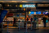 People purchase food in a branch of the bakery chain Greggs inside London Bridge station.