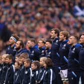 The Scotland team sing the national anthem during a Six Nations Rugby match at Murrayfield Stadium