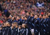 The Scotland team sing the national anthem during a Six Nations Rugby match at Murrayfield Stadium