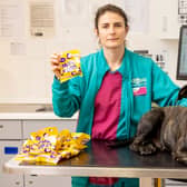 PDSA Veterinary Surgeon Team Leader Clare Sparks with Charlie and a kilo of Mini Eggs at PDSA in Bournemouth