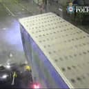 The car is seen smashing into the lorry.