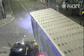 The car is seen smashing into the lorry.