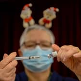 Pfizer BioNTech vaccines are prepared at Army Reserve Centre on December 23, 2021 in Poole, England.  (Photo: Getty)