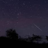 A meteor streaking through the night sky over Myanmar during the Geminid meteor shower in 2018 (Photo: YE AUNG THU/AFP via Getty Images)