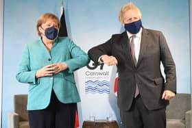 Prime Minister Boris Johnson greets German Chancellor Angela Merkel, ahead of a bilateral meeting during the G7 summit in Carbis Bay (Photo: Stefan Rousseau - WPA Pool/Getty Images)