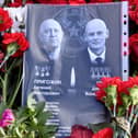 Sheet of paper with portraits of Yevgeny Prigozhin and Dmitry Utkin, a shadowy figure who managed Wagner’s operations and allegedly served in Russian military intelligence, is placed at a makeshift memorial in front of the Private Military Company (PMC) Wagner Centre in Saint Petersburg, on August 26.