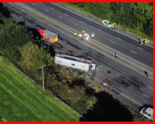 Emergency services at the scene of a coach crash on the M53 motorway, between junction 5 at Ellesmere Port and junction 4 at Bebbington. 