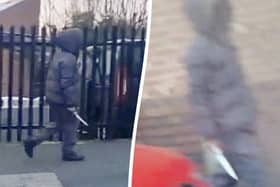 The moment a hooded knifeman casually walked down the street brandishing a huge blade near a Birmingham primary school. Picture:  Birmz Is Grime / SWNS