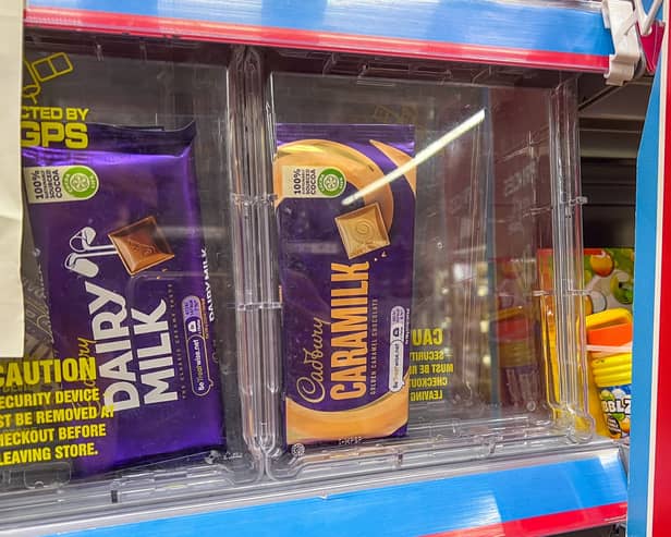 Numerous products are being kept in security boxes at supermarkets - including £2 chocolate bars (Photo: James Linsell Clark/SWNS)