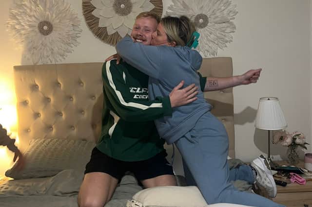 Son reveals tattoo to mum just before boarding plane to America.