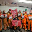 Offshore workers at Ninian Central platform with posters backing Unite the Union's No Ban Without a Plan campaign.