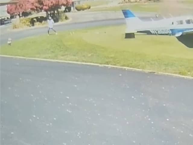 Plane smashes into golf course narrowly missing golfer.