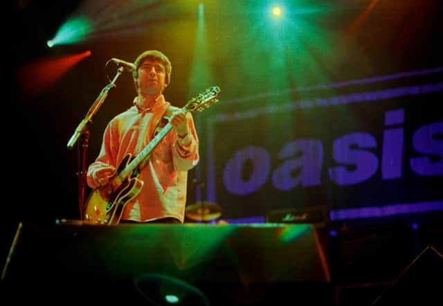 Noel Gallagher of Oasis performs on stage. Photo: Stacia Timonere/Getty Images