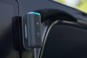 The Echo Auto sits discreetly on your dashboard, ready to take commands