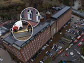 Car are flooded outside a newly converted Meadow Mill on Water street in Stockport as emergency teams arrive to rescue people trapped inside. January 1 2025.