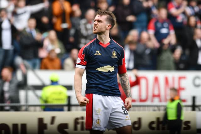 Falkirk ace Brad Spencer celebrates scoring the penalty that secured the Bairns' unbeaten League One title (Photo: Michael Gillen)