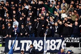 Falkirk fans back the Bairns from the Kevin McAllister Stand during a Scottish Championship match