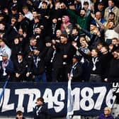 Falkirk fans back the Bairns from the Kevin McAllister Stand during a Scottish Championship match