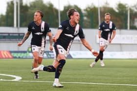 Falkirk winger Ethan Ross wheels away to celebrate after scoring to make it 1-1 against Hamilton Accies