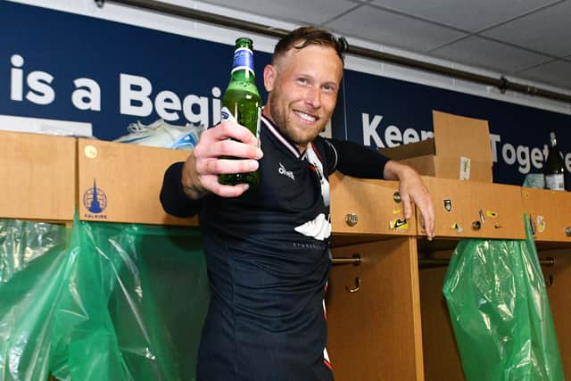 Falkirk star Scott Arfield enjoying the post-match celebrations in the dressing room after the 3-1 win over Hamilton Accies that secured the Scottish Championship title