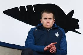 Falkirk CEO Jamie Swinney watches on