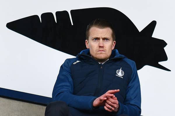 Falkirk CEO Jamie Swinney watches on