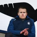 Falkirk CEO Jamie Swinney watches on