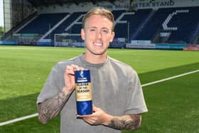 Calvin Miller with his award