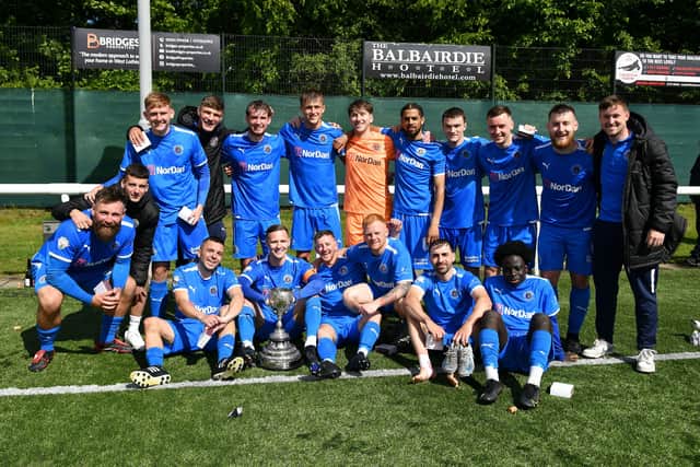 Bo'ness Athletic's King Cup-winning squad with the trophy after Saturday's 6-1 win over Leith Athletic