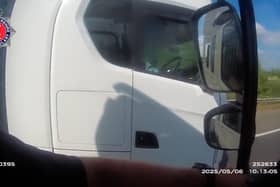Lorry driver caught rolling cigarette with no hands on wheel