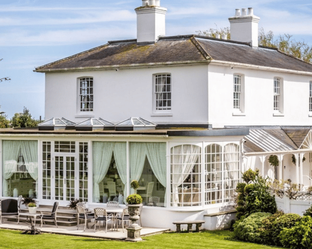 Merston House blends timeless Regency architecture with modern country living, complete with an orangery and sun-soaked patio for entertaining.