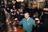 The Bow Bar manager Ian Whyte pictured with customers at the bar in 1990