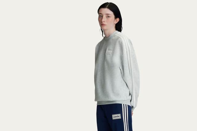The grey oversized crew is one of the standout everyday staples from the Oasis x Adidas Originals drop.