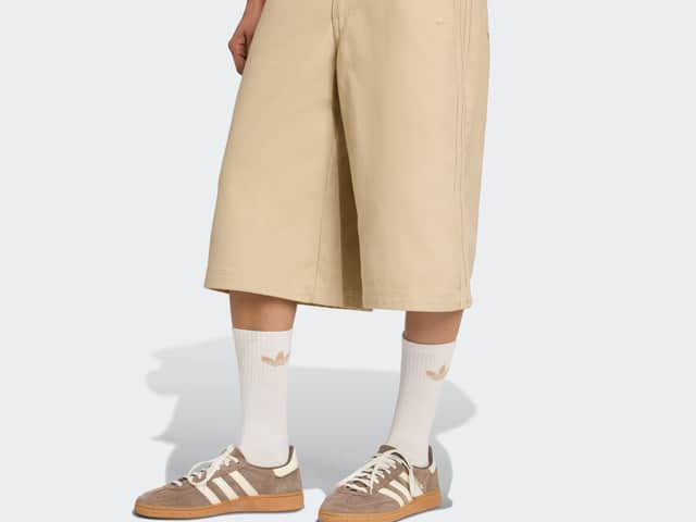The Firebird Utility Jorts bring oversized, street-ready styling to the Oasis x Adidas collection – a bold nod to ’90s sportswear culture.