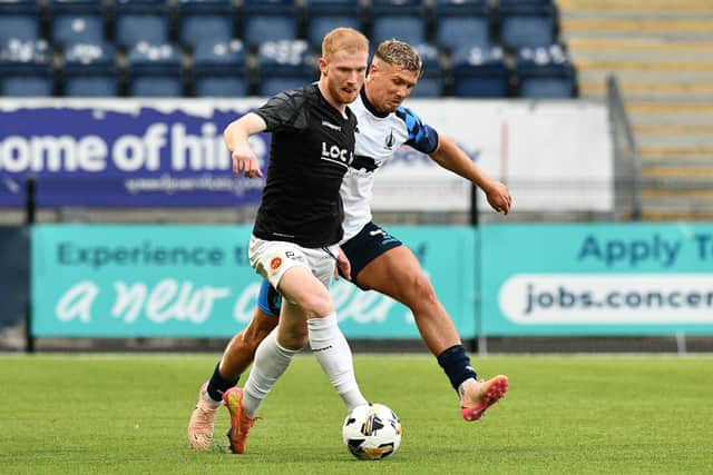 Falkirk centre-back Tom Lang in action up against Stenhousemuir's Euan O'Reilly last weekend