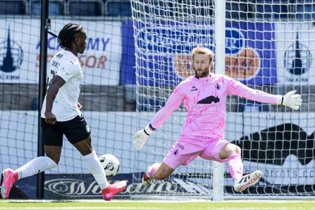 Tiwi Daramola slots home his second goal against Falkirk to double Edinburgh City's advantage