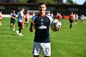 Dylan Tait with the match ball after netting a hat-trick