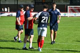 Falkirk manager John McGlynn congratulates hat-trick hero Dylan Tait