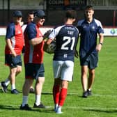 Falkirk manager John McGlynn congratulates hat-trick hero Dylan Tait