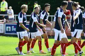 Scott Arfield celebrates scoring with his Falkirk team-mates including Hearts loanee Lewis Neilson