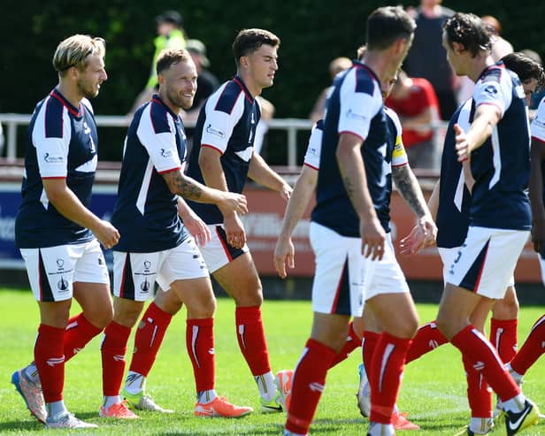 Scott Arfield celebrates scoring with his Falkirk team-mates including Hearts loanee Lewis Neilson