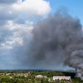 Smoke caused by a fire billows above the site of the Tomorrowland electronic music festival in Boom, northern Belgium on July 16, 2025.
