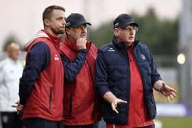 John McGlynn alongside Stephen McGinn and Paul Smith