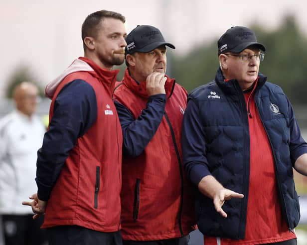 John McGlynn alongside Stephen McGinn and Paul Smith