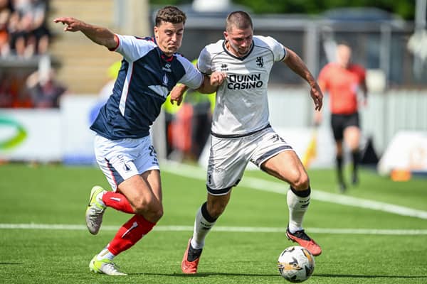 Lewis Neilson tussles for possession with Dundee United's Max Watters