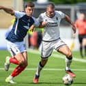Lewis Neilson tussles for possession with Dundee United's Max Watters