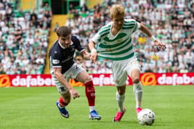 Falkirk full-back Ryan Strain chases down Celtic winger Hyun-jun Yang